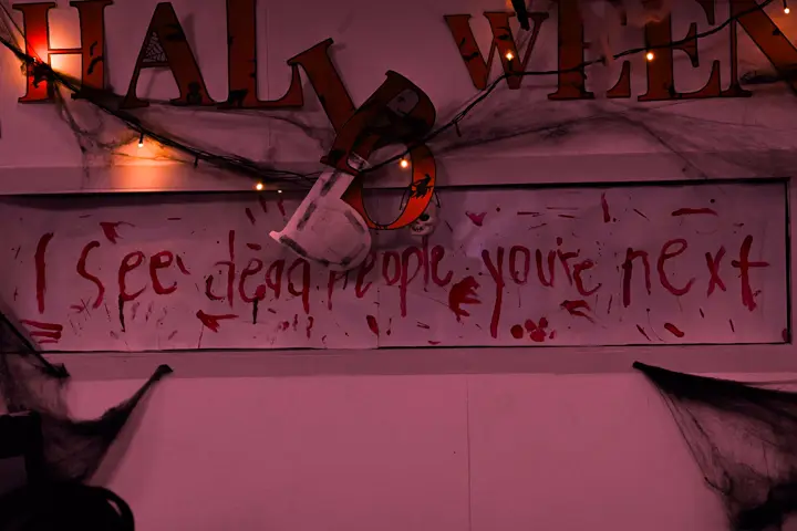 Bloody 'I see dead people, you're next' banner